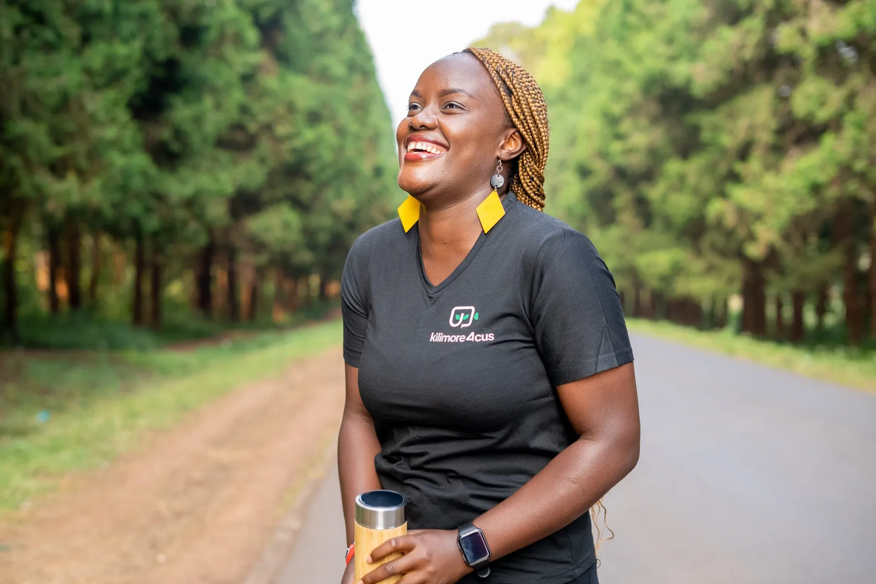 A young Kilimore4CUS team member walking on a farm road